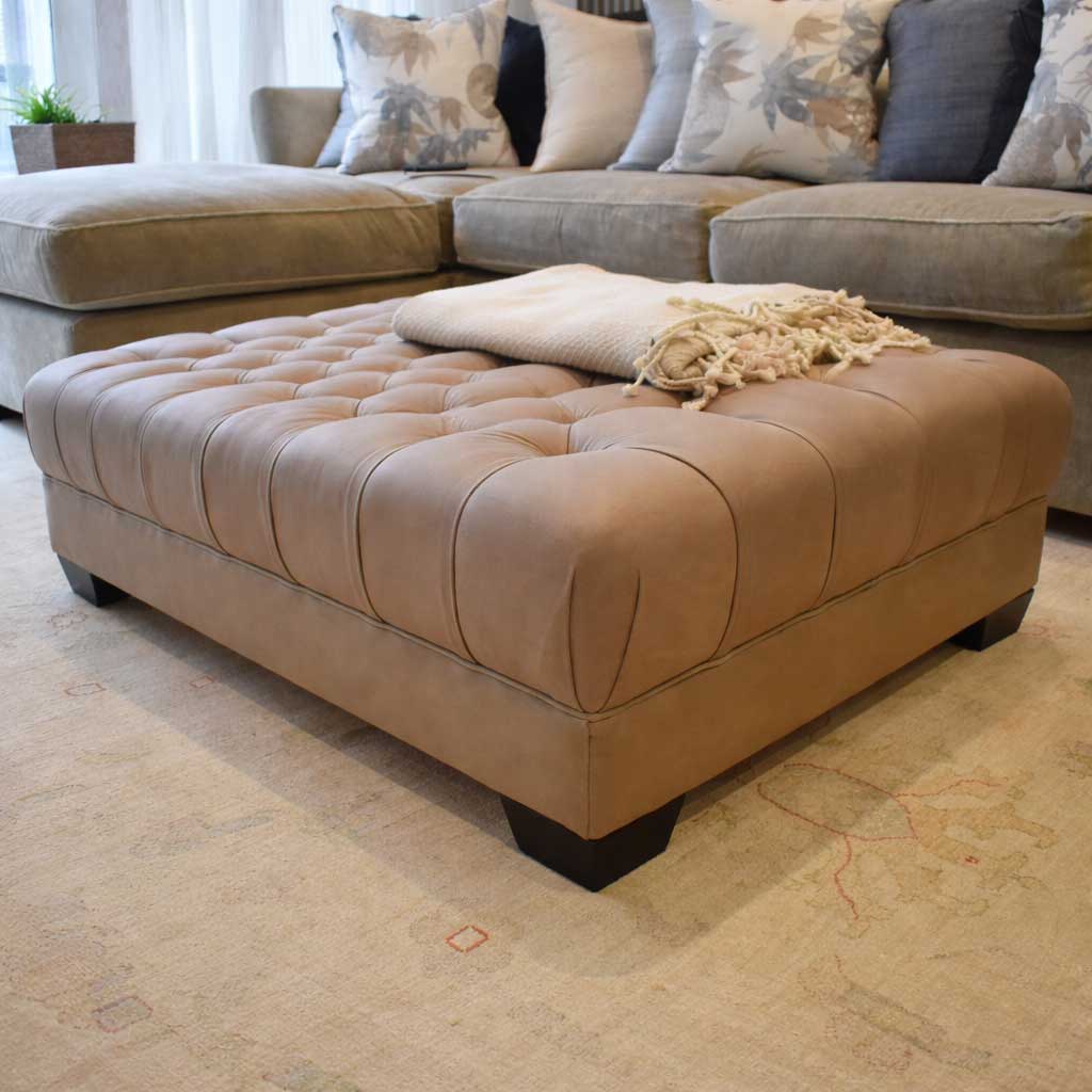 Deep buttoned footstool in Brunel hide SALE OFFER