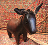 A Leather Donkey Footstool by Omersa